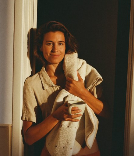 Maren Cole holding a towel and a mug